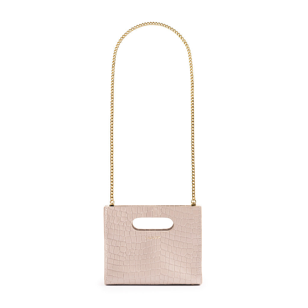 Beige textured cassette bag with a visible brand logo and long gold chain strap on a white background