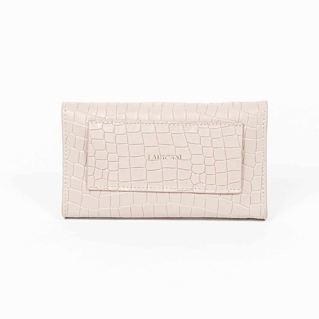 Back of a beige mini clutch bag on a white background