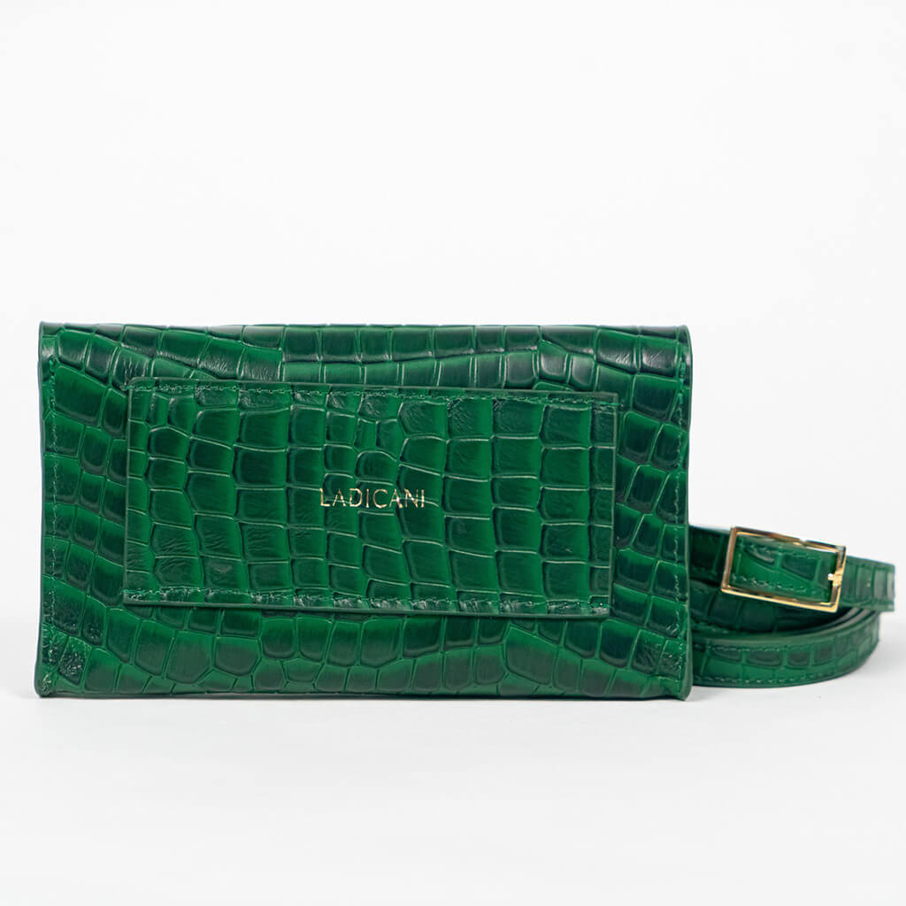 Back of green mini clutch bag with matching belt on a white background