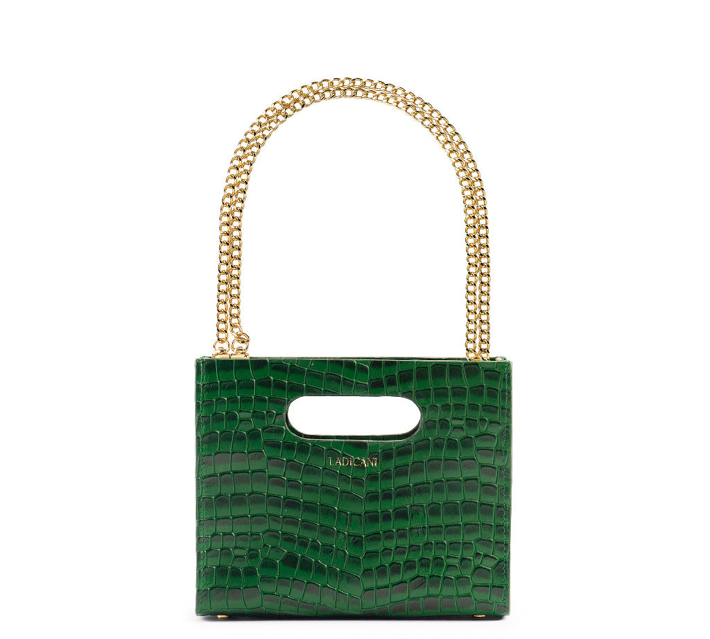 Green textured cassette bag with a visible brand logo and short gold chain strap on a white background