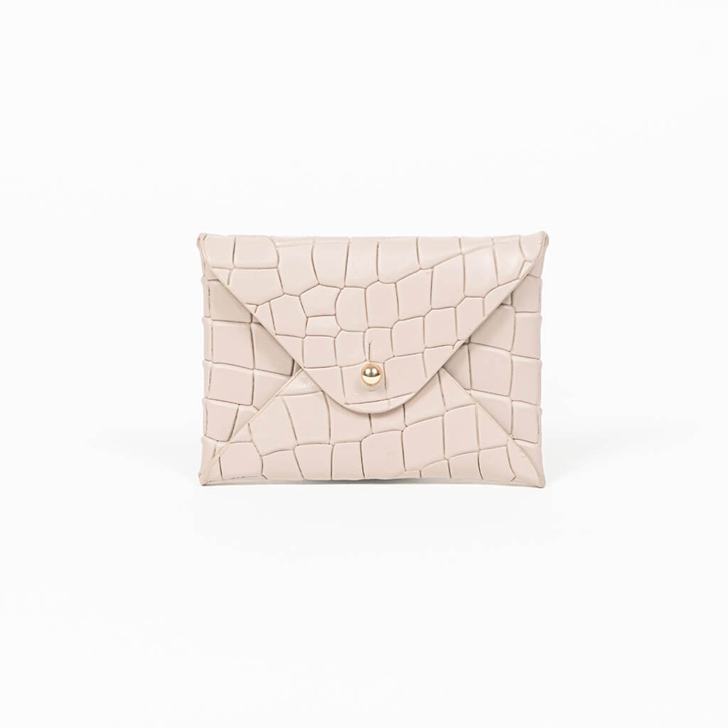 Beige leather cardholder on a white background