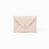 Beige leather cardholder on a white background