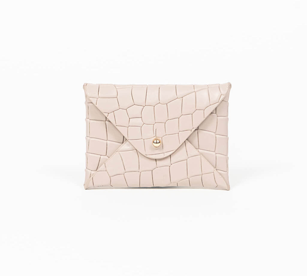 Beige leather cardholder on a white background