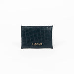 Back of a black leather cardholder on a white background