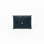 Black leather cardholder on a white background