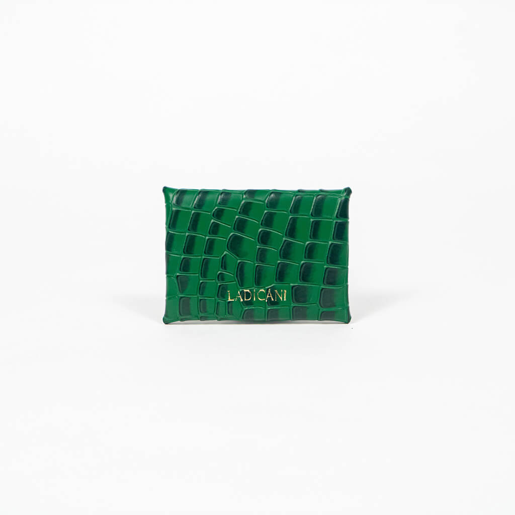 Back of a green leather cardholder on a white background