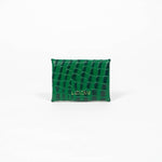 Back of a green leather cardholder on a white background