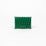 Back of a green leather cardholder on a white background