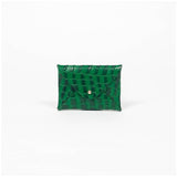 Green leather cardholder on a white background
