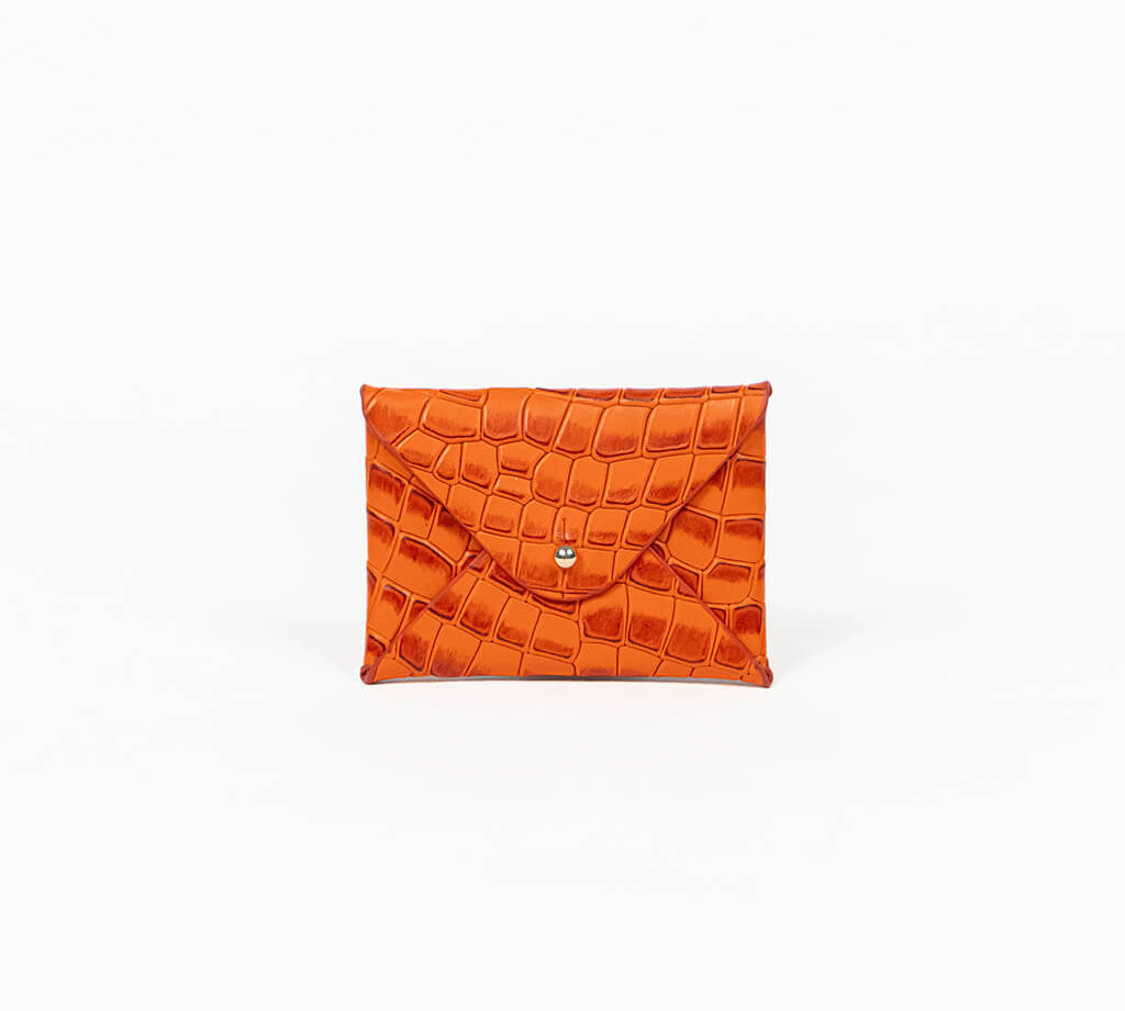 Orange leather cardholder on a white background