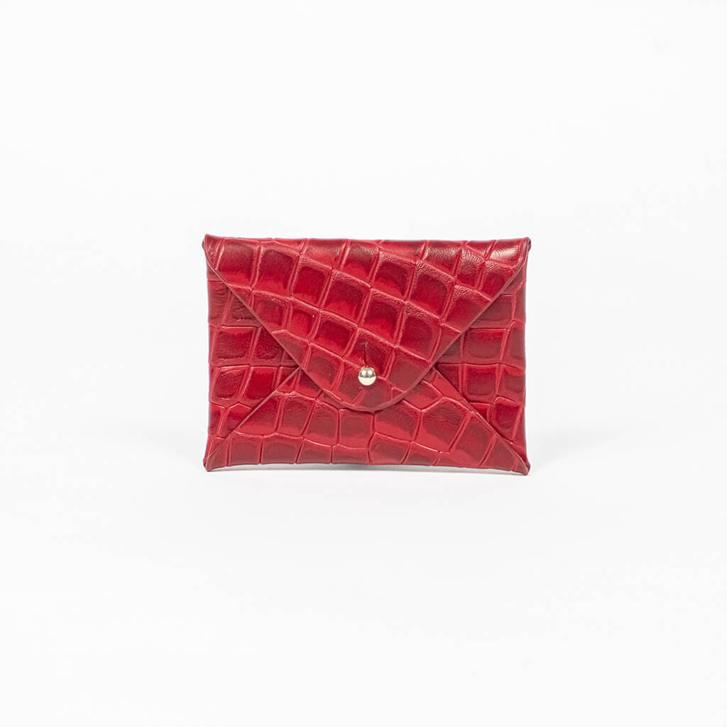 Red leather cardholder on a white background