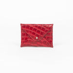 Red leather cardholder on a white background