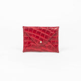 Red leather cardholder on a white background