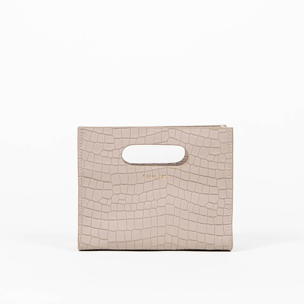 Beige textured cassette bag with a visible brand logo on a white background