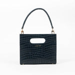 Black textured cassette bag with a visible brand logo and strap on a white background