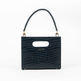 Black textured cassette bag with a visible brand logo and strap on a white background