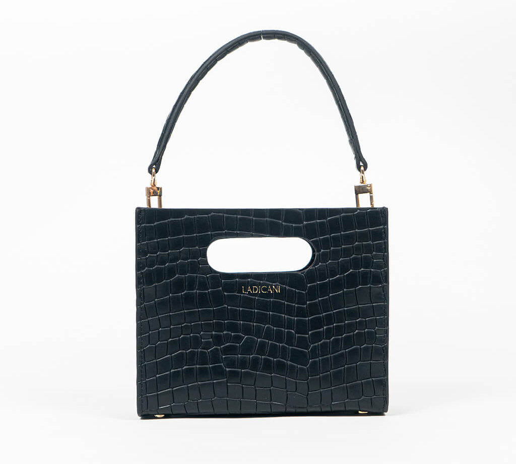 Black textured cassette bag with a visible brand logo and strap on a white background