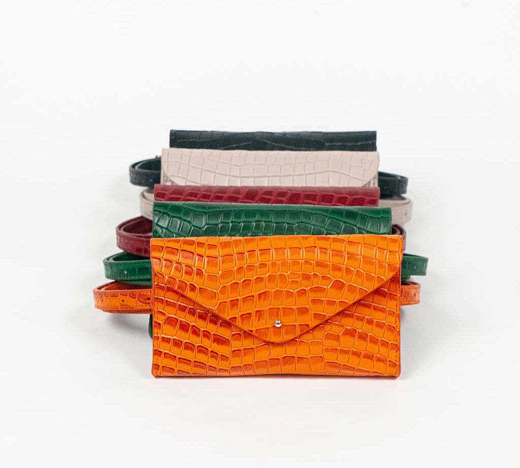 Set of colorful mini clutch bags on a white background, front facing