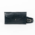 Black mini clutch bag with matching belt on a white background