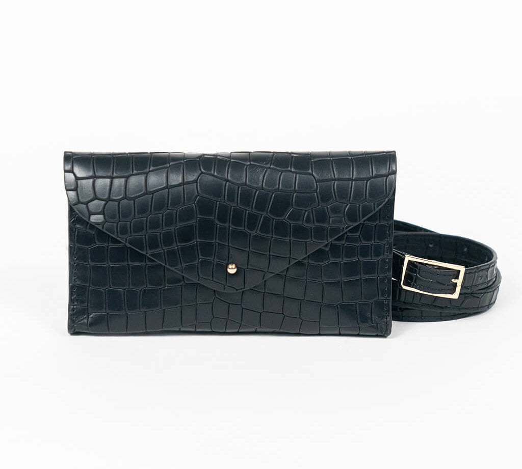 Black mini clutch bag with matching belt on a white background