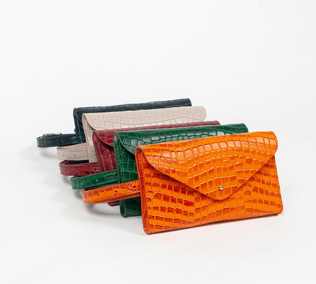Set of colorful mini clutch bags on a white background