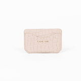 Beige leather slim wallet with branding on a white background
