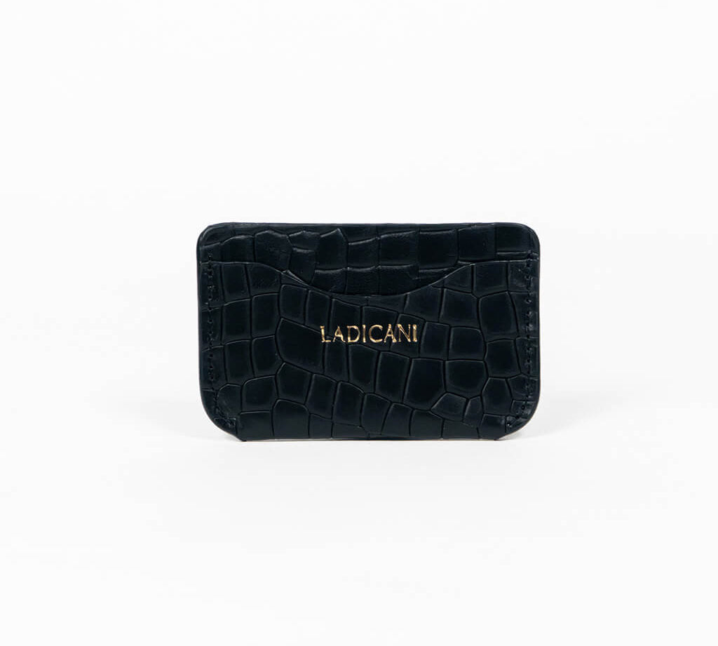 Black leather slim wallet with branding on a white background