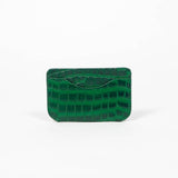 Back of a green leather slim wallet with branding on a white background