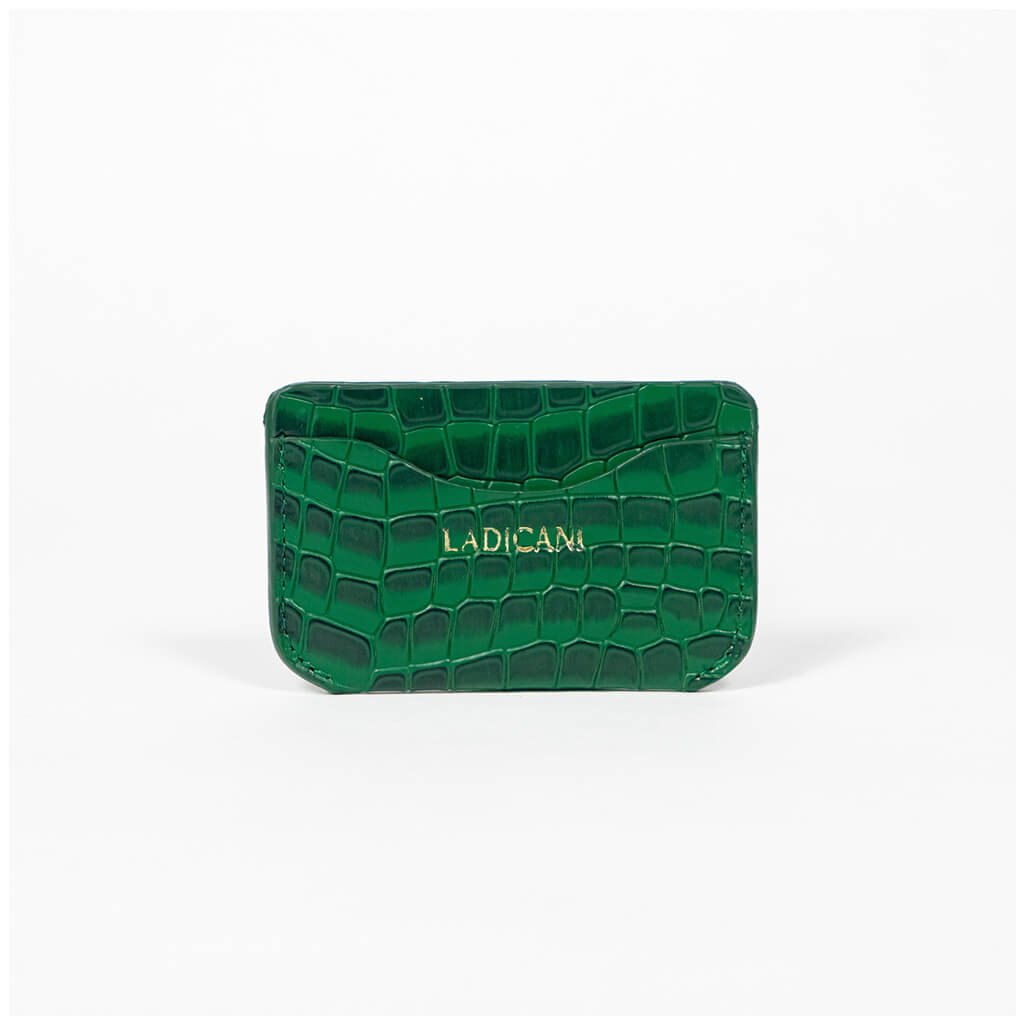 Green leather slim wallet with branding on a white background