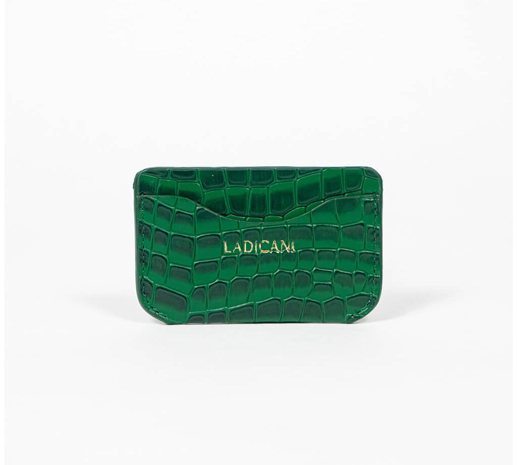 Green leather slim wallet with branding on a white background
