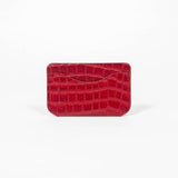 Back of a red leather slim wallet on a white background