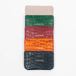 Colorful leather slim wallets with branding on a white background